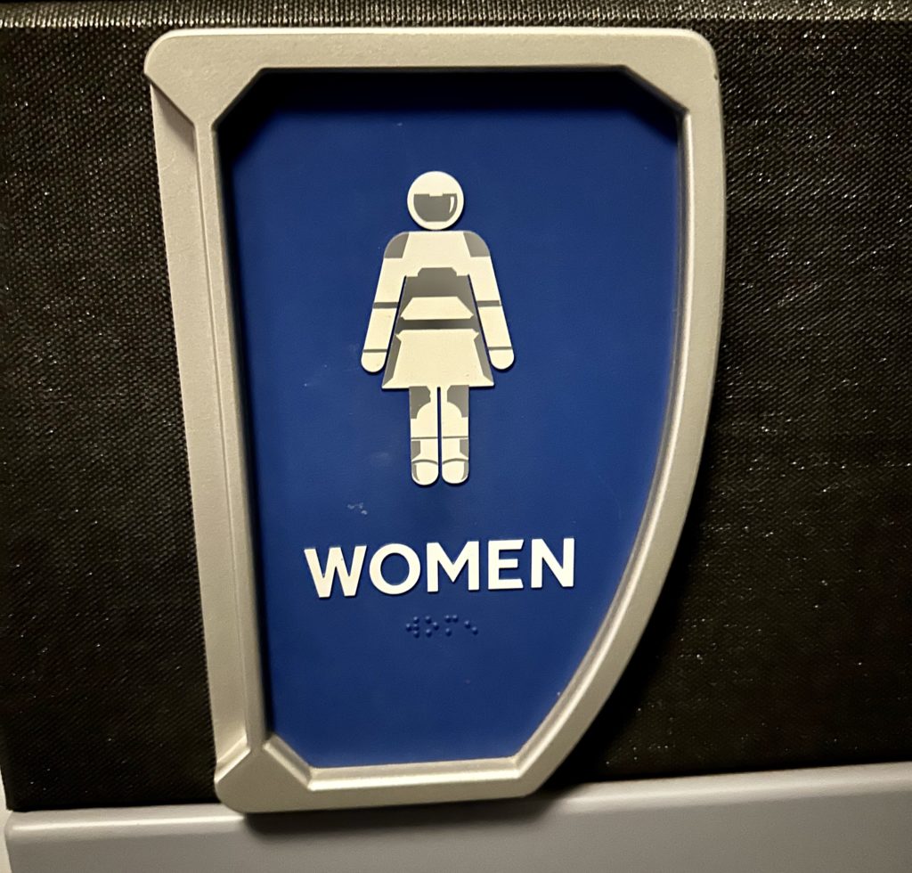 Space 220 women's bathroom sign