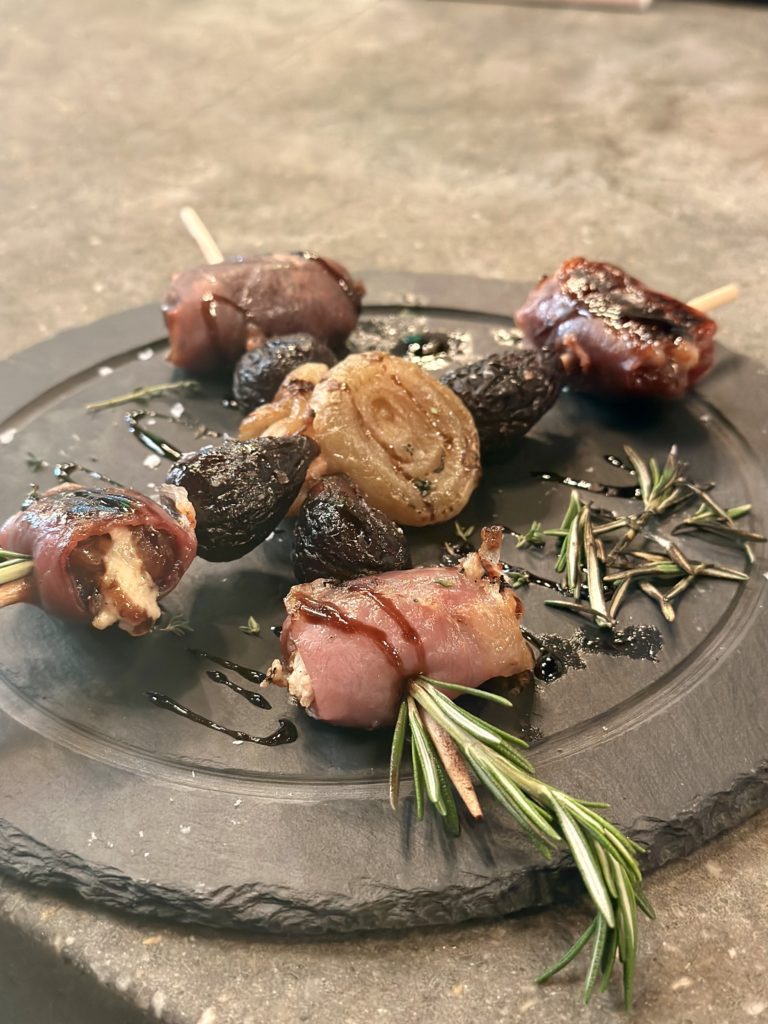 Stuffed dates wrapped in prosciutto from Jock Lindsey's Hangar Bar