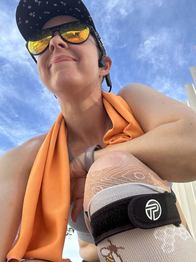 Jenn uses kinesio tape and a patellar tendon strap